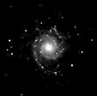 M74 is an face on spiral galaxy in Pisces. This image is from the Palomar Sky Survey as published on the Real Sky CD from the Astronomical Society of the Pacific.